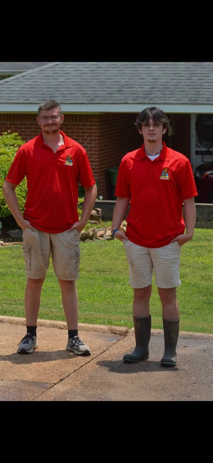 Two HoneyBee crew members in company polos